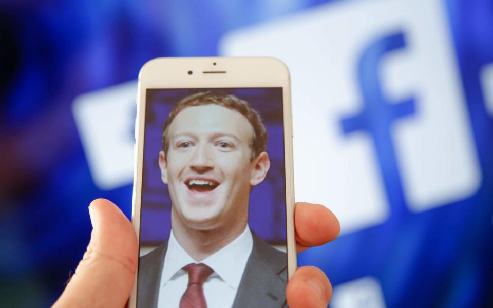 A portrait of Facebook found Mark Zuckerberg is seen on an iPhone - NurPhoto