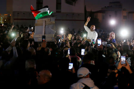 FILE PHOTO: Protesters chant slogans during a protest against tax hikes in Amman, Jordan November 30, 2018. REUTERS/Muhammad Hamed/File Photo