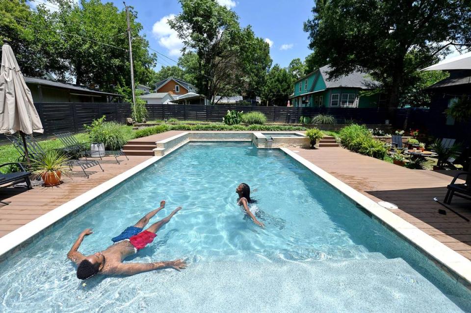 Shane Richards and Samantha Flanigan enjoy an afternoon swim at a Charlotte, NC home on Wednesday, July 14, 2021. The owner placed his pool on the app Swimply last month. The app gives pool owners the ability to charge people to use their pool by the hour.