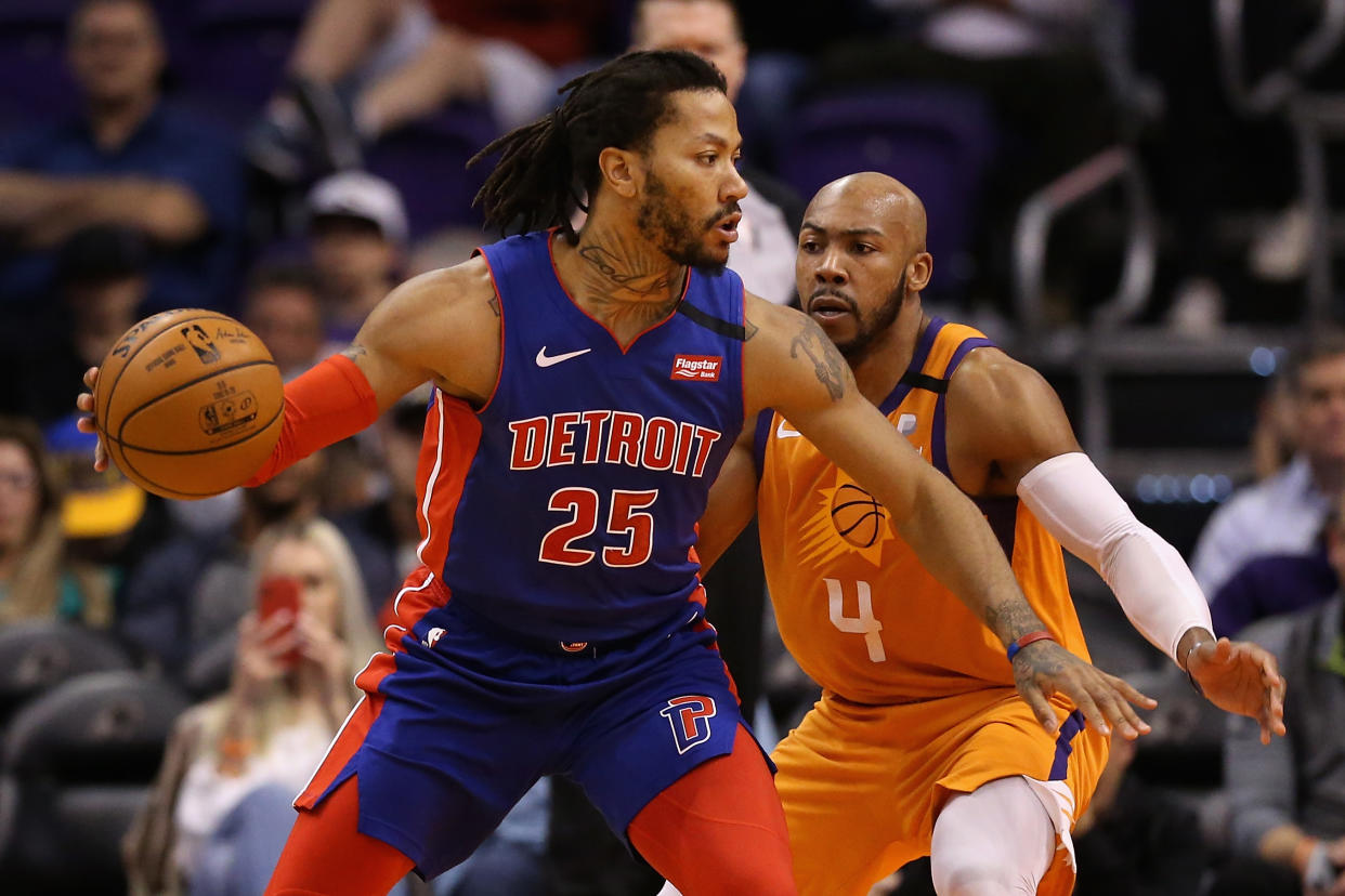 PHOENIX, ARIZONA - FEBRUARY 28: Derrick Rose #25 of the Detroit Pistons handles the ball against Jevon Carter #4 of the Phoenix Suns during the second half of the NBA game at Talking Stick Resort Arena on February 28, 2020 in Phoenix, Arizona. The Pistons defeated the Suns 113-111. NOTE TO USER: User expressly acknowledges and agrees that, by downloading and or using this photograph, user is consenting to the terms and conditions of the Getty Images License Agreement. Mandatory Copyright Notice: Copyright 2020 NBAE. (Photo by Christian Petersen/Getty Images)