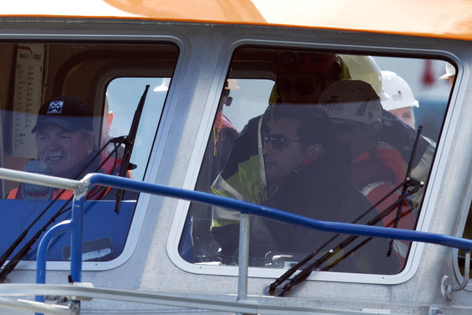 Captain Francesco Schettino sits in the boat that is taking him aboard the wreck of the Costa Concordia cruise ship, just off the coast of the Giglio island, Thursday, Feb. 27, 2014. The captain of the Costa Concordia has been permitted to go aboard the shipwreck for the first time since it capsized two years ago as part of a new court-ordered search. Consumer groups and lawyers for Capt. Francesco Schettino asked the court in Grosseto to authorize the searches to determine if any factors beyond human error contributed to the disaster. After searching the bridge and elevators last month, experts will examine the emergency generators Thursday. (AP Photo/Andrew Medichini)