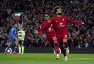 Liverpool's Mohamed Salah celebrates after scoring his side's opening goal during the English Premier League soccer match between Liverpool and Manchester City at Anfield stadium in Liverpool, Sunday, Oct. 16, 2022. (Peter Byrne/PA via AP)