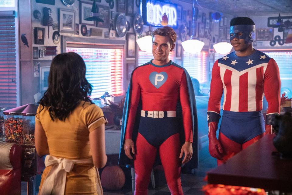 RIVERDALE, from left: Camila Mendes (back to camera), KJ Apa, Eli Goree, 'Chapter Sixty-One: Halloween', (Season 4, ep. 404,