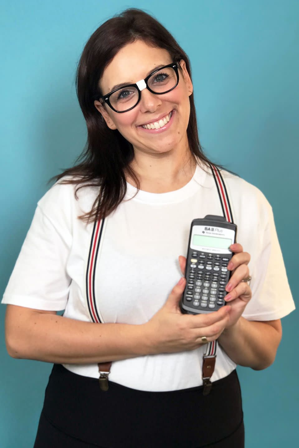 <p>Layer suspenders over a white t-shirt and wrap some white tape around the center of thick-rimmed glasses. Don't forget your BFF a.k.a. your calculator!<br></p>