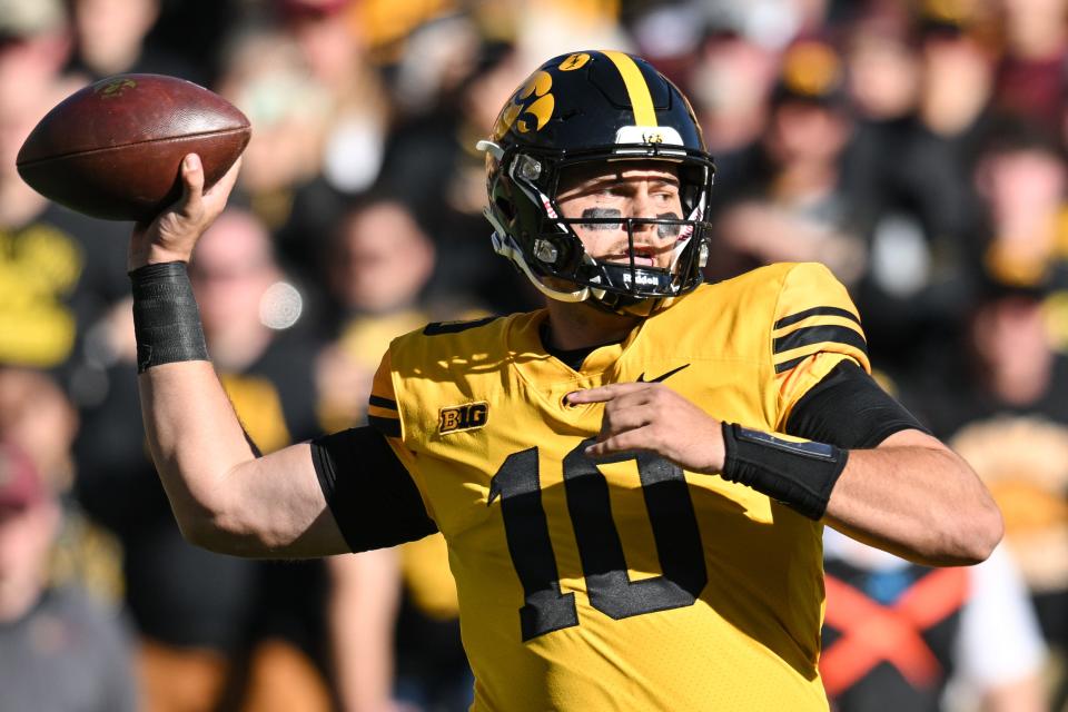 Oct 21, 2023; Iowa City, Iowa, USA; Iowa Hawkeyes quarterback Deacon Hill (10) throws a pass against the Minnesota Golden Gophers during the second quarter at Kinnick Stadium. Mandatory Credit: Jeffrey Becker-USA TODAY Sports