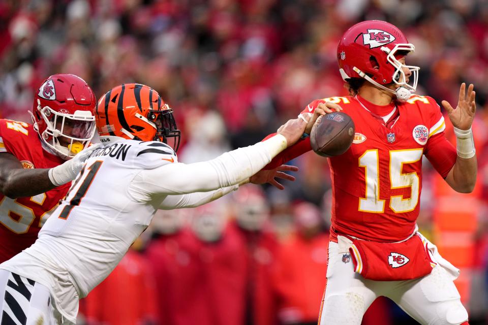 Cincinnati Bengals defensive end Trey Hendrickson (91) forces a fumble of Kansas City Chiefs quarterback Patrick Mahomes (15) in the second quarter during a Week 17 NFL football game between the Cincinnati Bengals and the Kansas City Chiefs, Sunday, Dec. 31, 2023, at GEHA Field at Arrowhead Stadium in Kansas City, Mo.