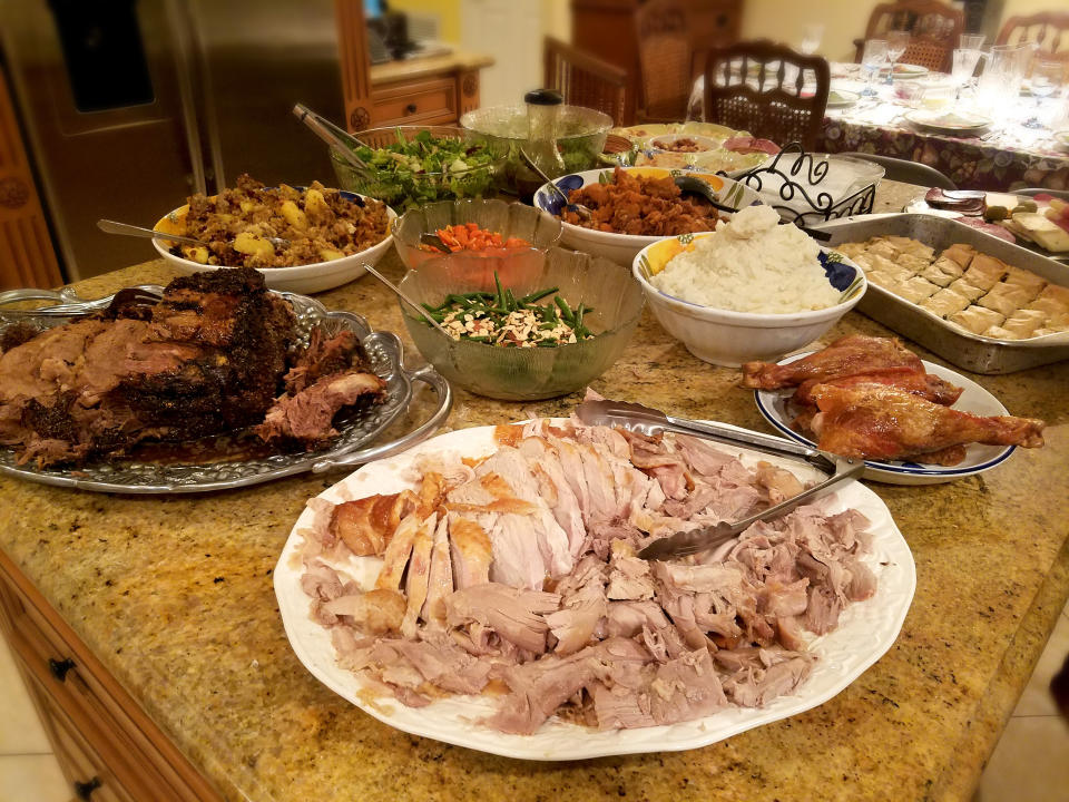 turkey and other vegetable dishes on a thanksgiving table