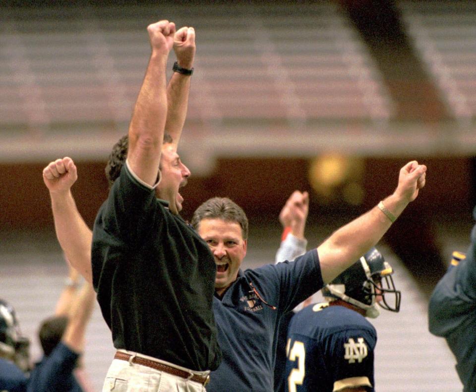 Mike D'Aloisio, front, and Dick Craft celebrate an Elmira Notre Dame victory.