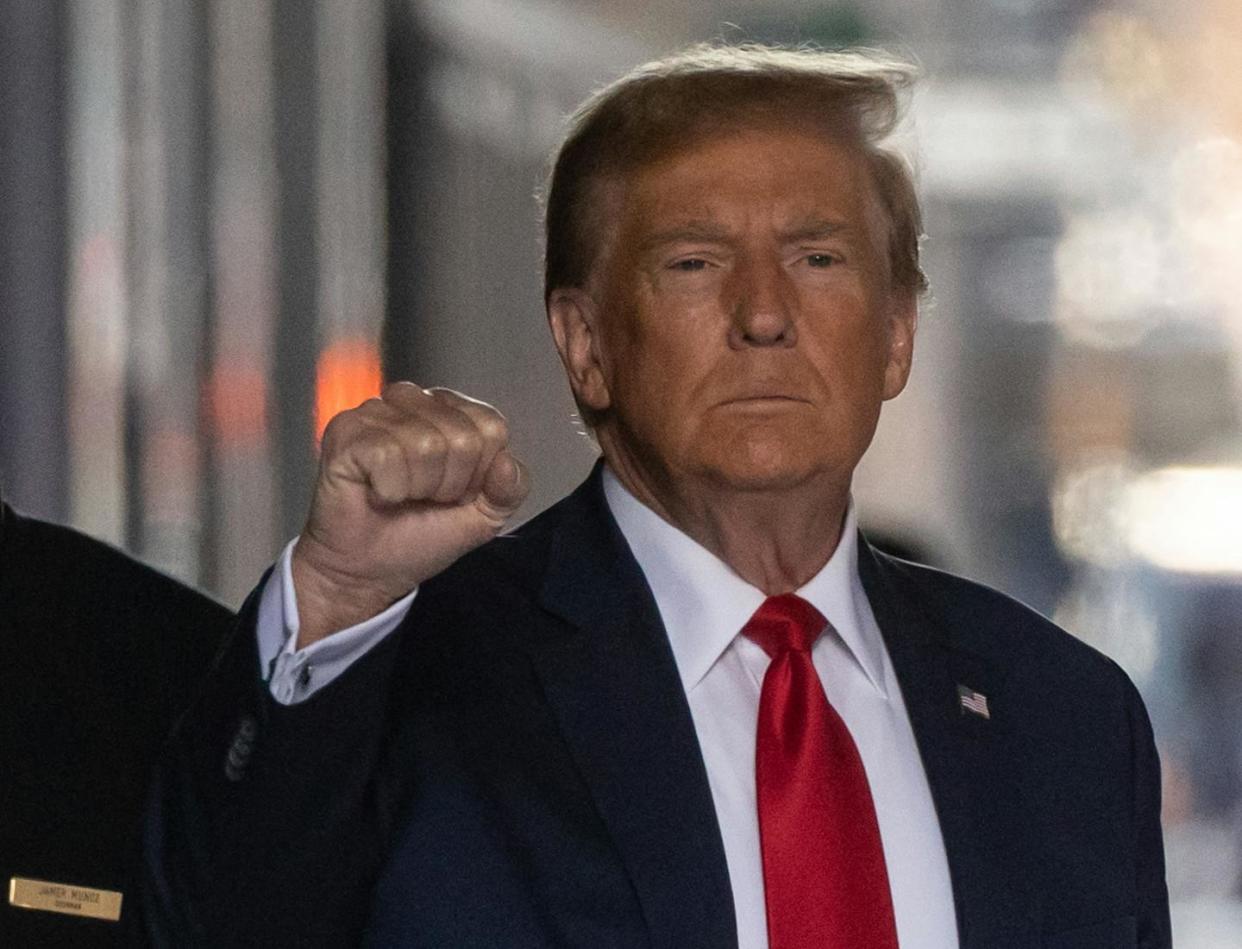 Former President Donald Trump stands trial on April 15, 2024. <a href="https://www.gettyimages.com/detail/news-photo/former-us-president-donald-trump-raises-his-fist-as-he-news-photo/2005149456?adppopup=true" rel="nofollow noopener" target="_blank" data-ylk="slk:Yuki Iwamura//AFP via Getty Images;elm:context_link;itc:0;sec:content-canvas" class="link ">Yuki Iwamura//AFP via Getty Images</a>