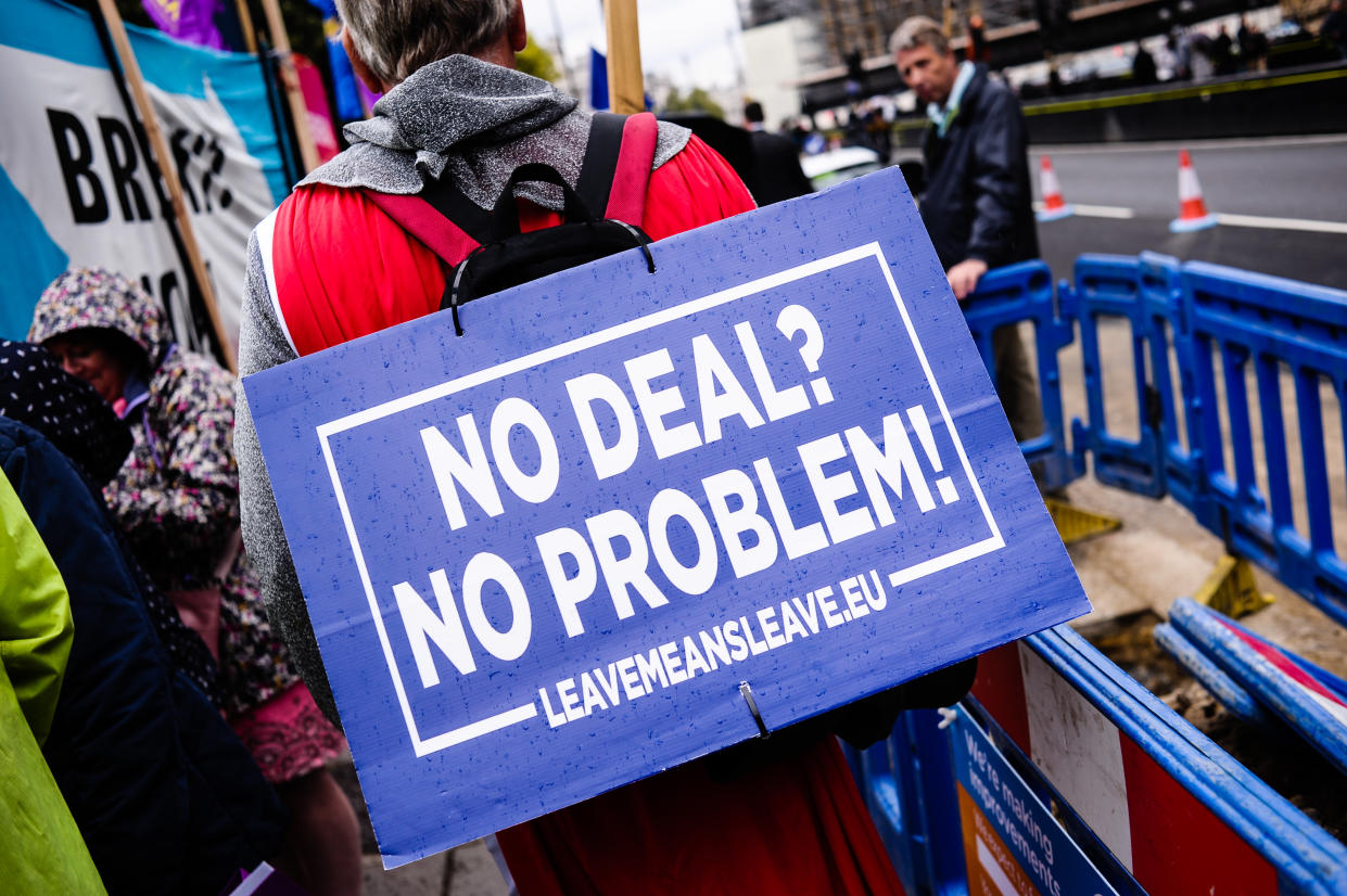 A pro-Brexit activist holds a placard that says No Deal? No Problem!' outside the Houses of Parliament in London on the day of the prorogation of the parliamentary session, which will see parliamentary activities suspended until mid-October. (Photo by David Cliff / SOPA Images/Sipa USA)