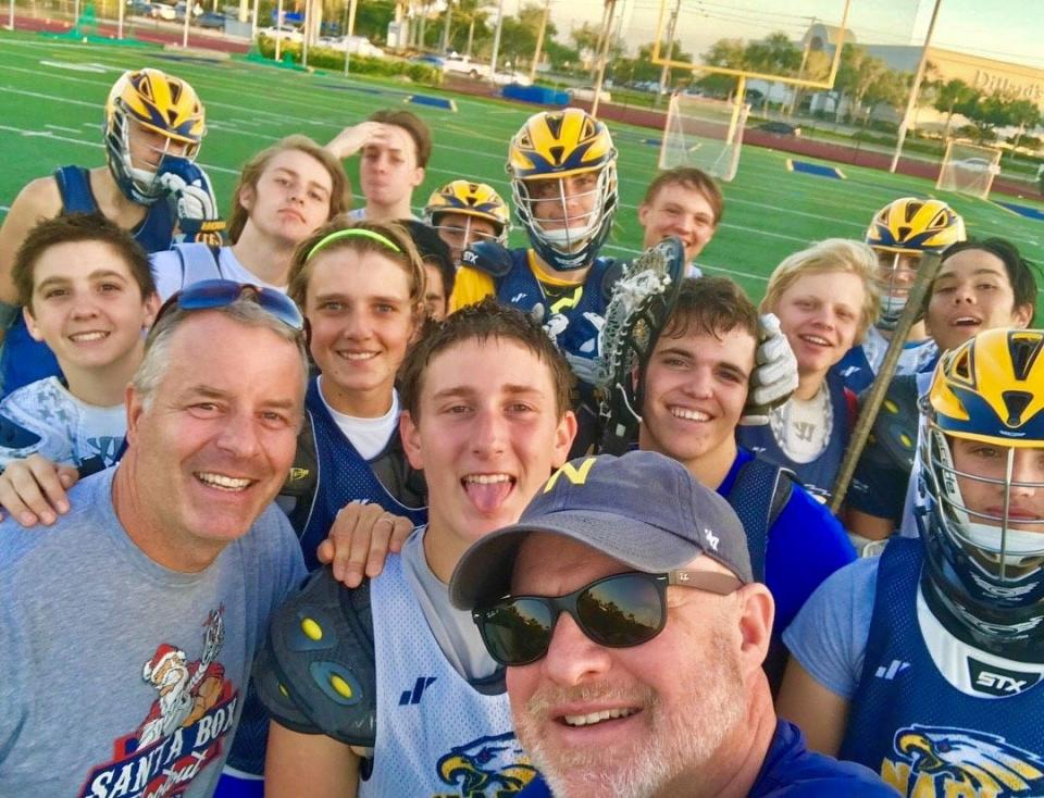 Kenny Coloma, middle front, with other members of the 2018 Naples High School's JV boys lacrosse team. The team ― which united for a selife after their final practice ― was coached by Dave Osborn, right, regional features editor for the Naples Daily News and The News-Press in Fort Myers, and Marshall Huggins, left.