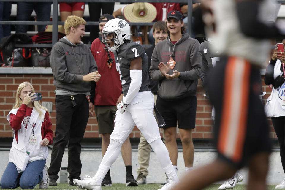 Washington State wide receiver Kyle Williams (2) celebrates his touchdown during the first half of an NCAA college football game against Oregon State, Saturday, Sept. 23, 2023, in Pullman, Wash. (AP Photo/Young Kwak)