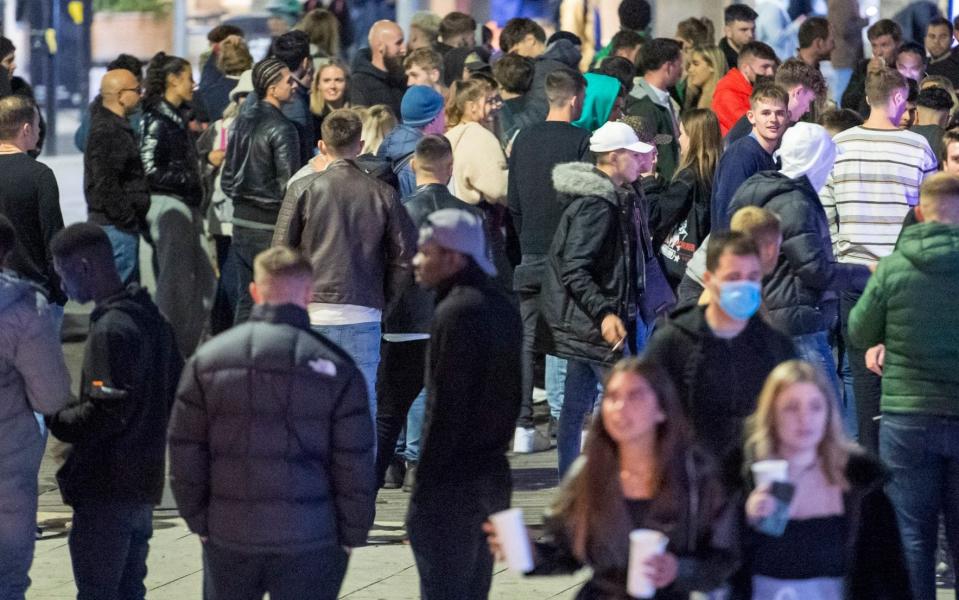 A crowd of people gather in the Bristol city centre after the 10pm curfew, leading to the early closing of pubs and bars. Last weekend was the first to feature the curfew - Simon Chapman/LNP/Simon Chapman/LNP