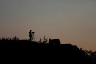 <p>A cameraman documenting the reconstruction project of the Jiankou section of the Great Wall, films as the sun rises over the wall, located in Huairou District, north of Beijing, China, June 7, 2017. (Photo: Damir Sagolj/Reuters) </p>