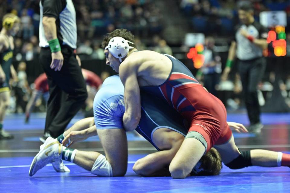 Pennsylvania’s Cole Urbas, who is a State College graduate, scrambles with North Carolina’s Max Shaw in their 197-pound preliminary round match of the NCAA Championships on Thursday, March 16, 2023 at the BOK Center in Tulsa, Okla. Shaw beat Urbas, 4-1.