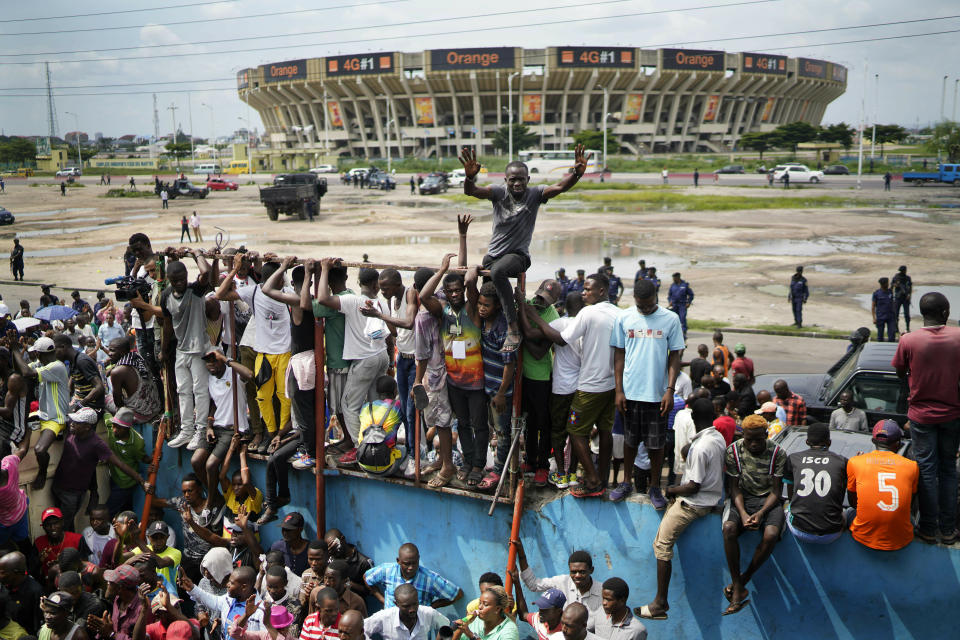 Supporters of spurned Congo opposition candidate Martin Fayulu listen to his speech at a rally in Kinshasha, Congo, Friday, Jan. 11, 2019. Hundreds gathered to denounce what they called "the people's stolen victory" in the presidential election. (AP Photo/Jerome Delay)