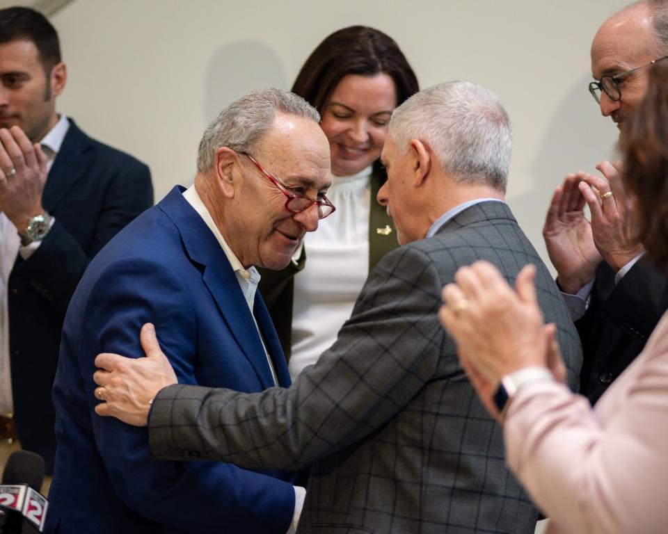 U.S. Senate Majority Leader Charles E. Schumer embraces Oneida County Executive Anthony Picente after announcing news of major federal funding to help create a new state-of-the-art semiconductor and advanced manufacturing job training center at Mohawk Valley Community College's Utica Campus on Thursday, January 12, 2023.