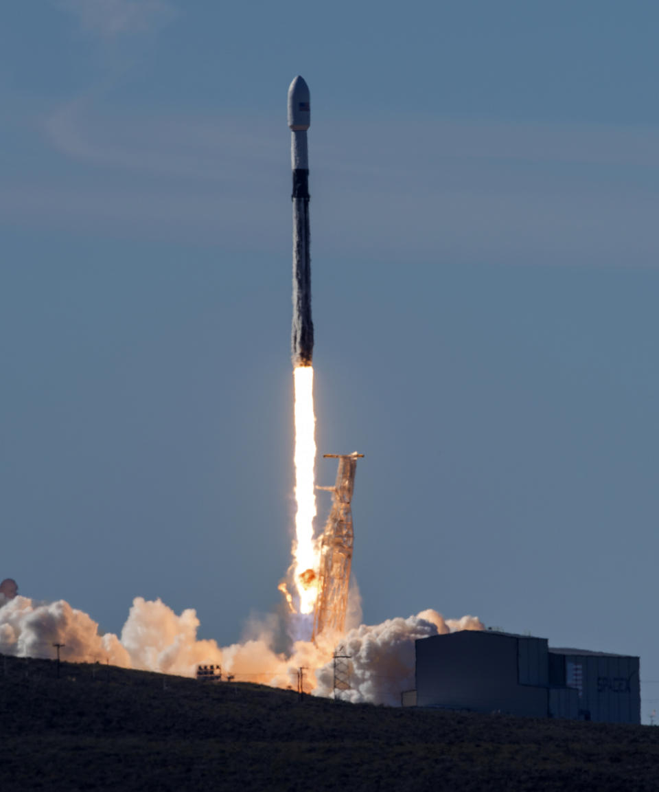 In this photo provided by the U.S. Air Force, a SpaceX Falcon 9 rocket, carrying the Spaceflight SSO-A: SmallSat Express, launches from Space Launch Complex-4E at Vandenberg Air Force Base, Calif., Monday, Dec. 3, 2018. The SpaceX rocket carrying 64 small satellites, marks the first time the same Falcon 9 rocket has been used in three space missions. (Senior Airman Clayton Wear/U.S. Air Force via AP)