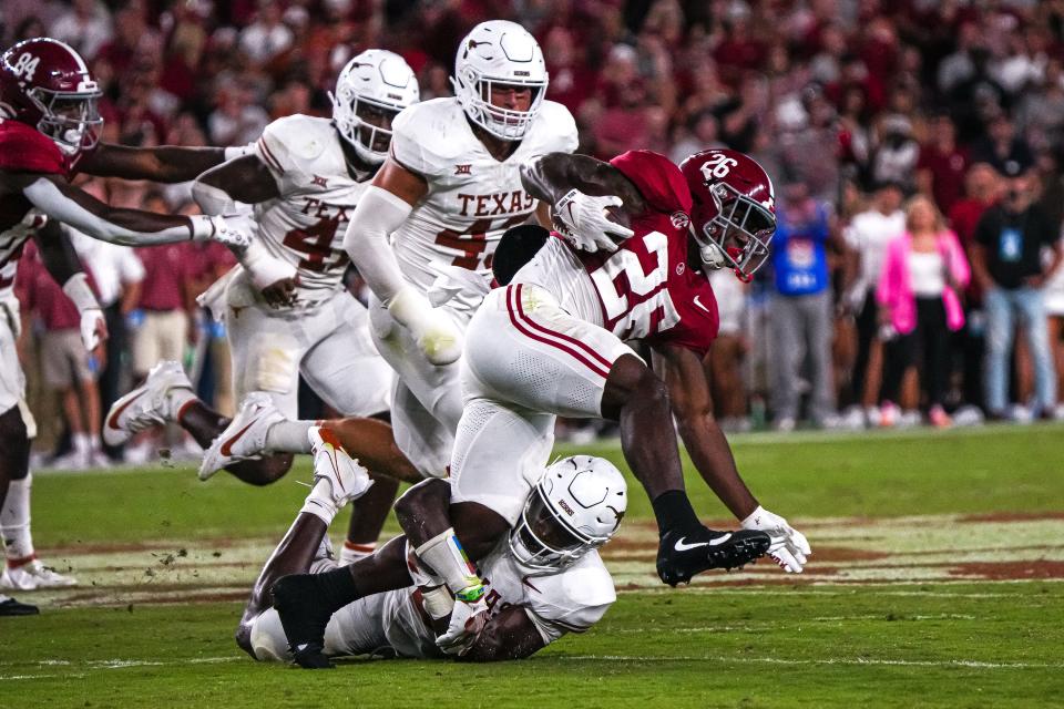 Texas defensive back Kitan Crawford tackles Alabama running back Jam Miller during the Longhorns' win at Bryant-Denny Stadium on Sept. 9.