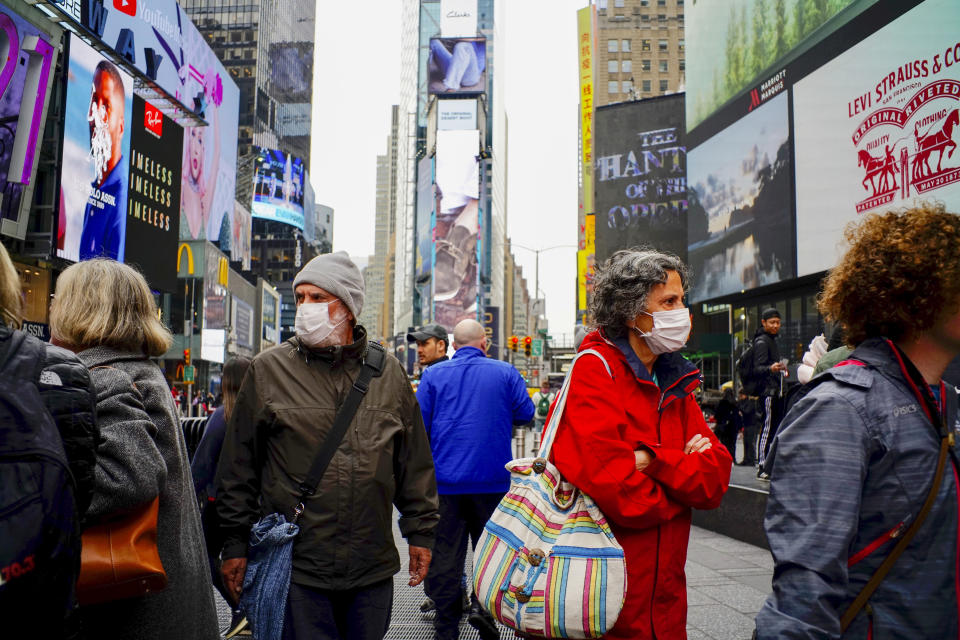 NEW YORK, NEW YORK - MARCH 03 : People wear face masks in Times Square New York on March 03, 2020. New York confirms second coronavirus case, as flights cancelations and Jewish schools close over virus fears.The first person to test positive for coronavirus in the state is a 39-year-old health-care worker who arrived from Iran with her husband, the second one is an attorney who lives in Westchester County, works in Manhattan, Gov. Andrew Cuomo said. (Photo by Eduardo Munoz / VIEWpress via Getty Images)