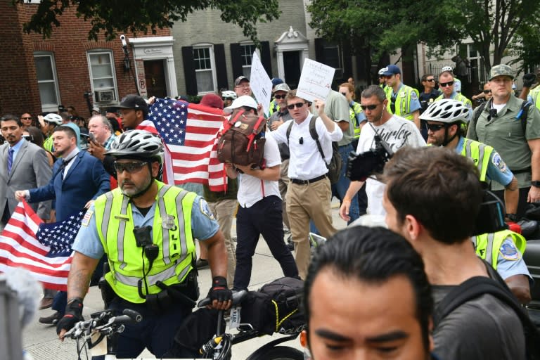 About 20 white nationalists trickled in from nearby Vienna, Virginia -- under heavy police escort -- at Washington's Foggy Bottom Metro station