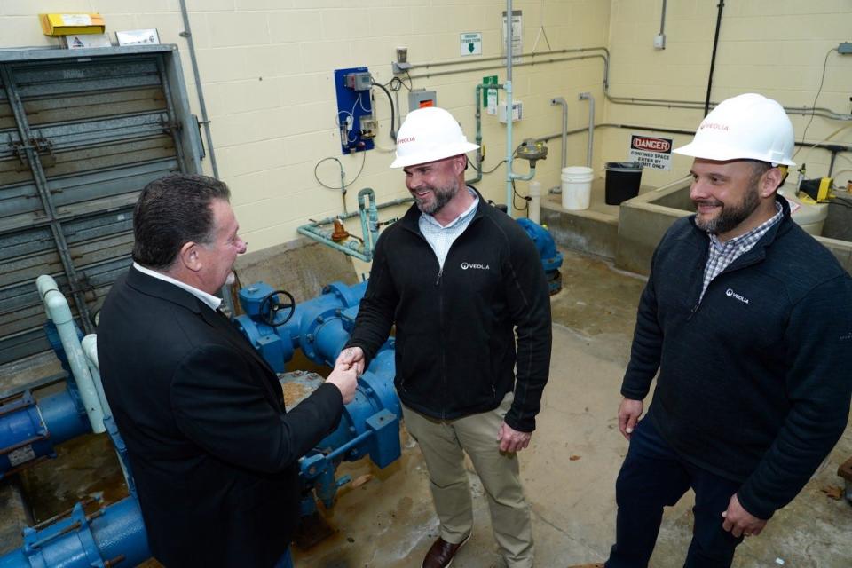 Allendale Director of Operations Ron Kistner welcomes Veolia Superintendent of Operations James Fahey, and Manager of Production Joshua Engelking inside Allendale's New Street treatment plant after the transfer to Veolia.