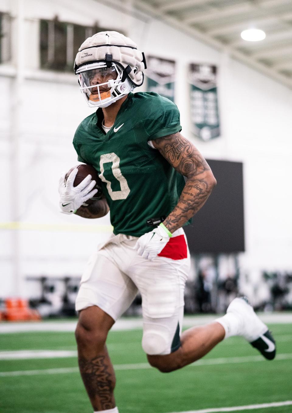 Michigan State wide receiver Keon Coleman goes through drills on Tuesday, March 28, 2023, in East Lansing.