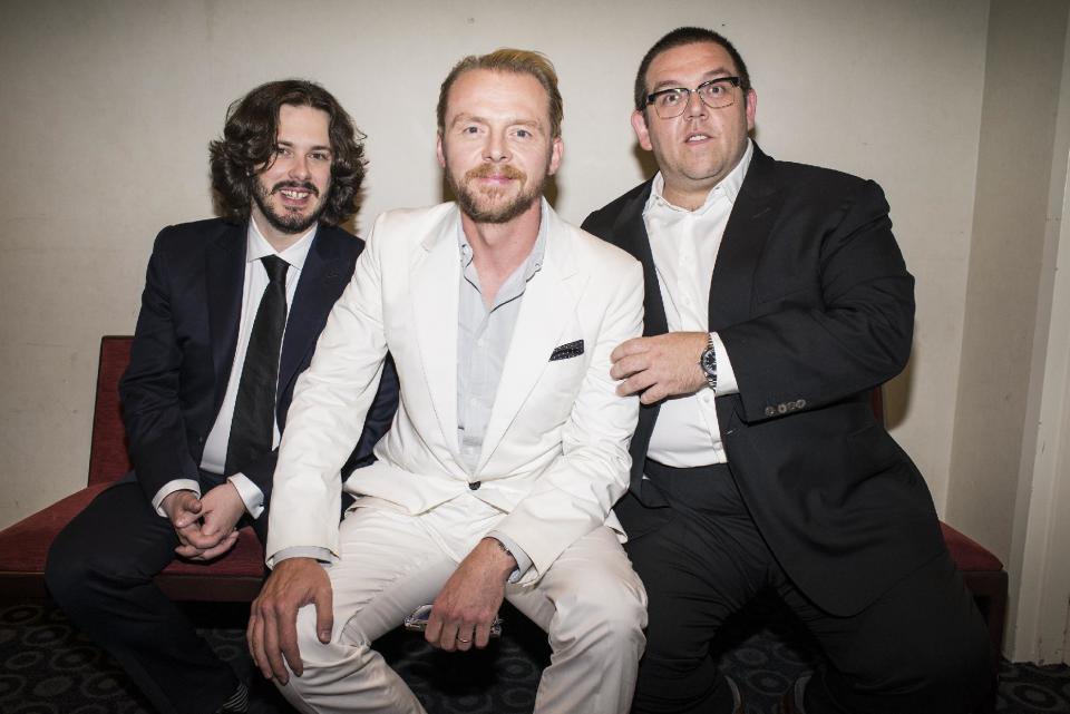 In this Wed., Aug. 21, 2013 photo, from left, director Edgar Wright, actor Simon Pegg, and actor Nick Frost pose for a portrait in the green room at the premiere of the feature film "The World's End" at the Cinerama Dome, in Los Angeles. It's not the end of the world, but "The World's End" marks a creative conclusion for Pegg, Frost and Wright. For the British trio behind "Shaun of the Dead" and "Hot Fuzz," the release on Friday, Aug. 23, 2013 of "The World's End" completes a trilogy. (Photo by Dan Steinberg/Invision/AP)