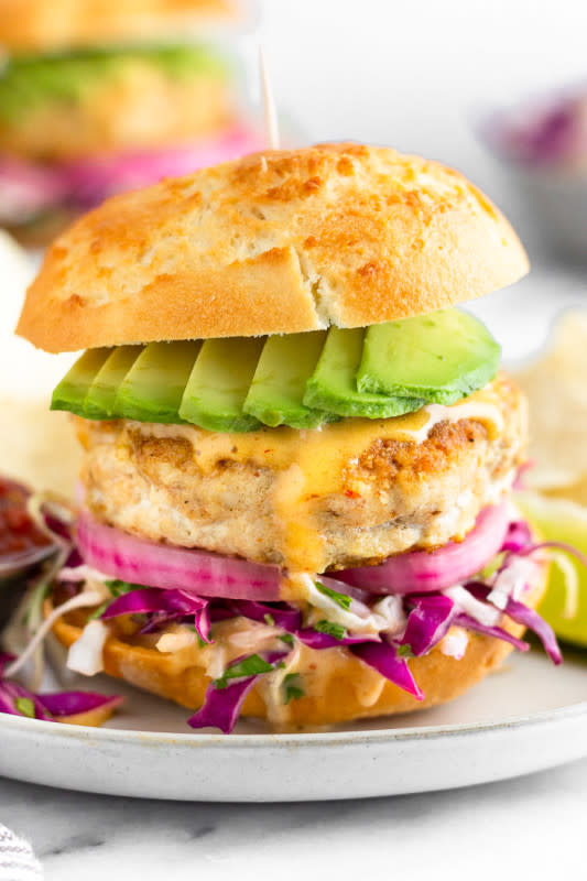 <p>The Eat Gains</p><p>Pan-fried taco-flavored mahi mahi burgers topped with a quick cabbage slaw, pickled onions, avocado and chipotle mayo.</p><p><strong>Get the recipe: <a href="https://eatthegains.com/mahi-mahi-burgers/" rel="nofollow noopener" target="_blank" data-ylk="slk:Mahi Mahi Burgers;elm:context_link;itc:0;sec:content-canvas" class="link ">Mahi Mahi Burgers</a></strong></p>