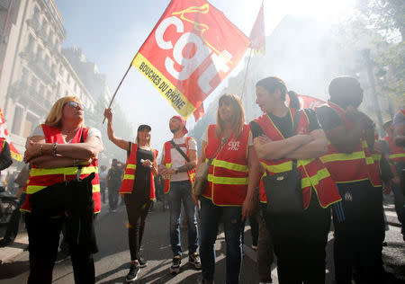 Workers wave CGT labour union flags during a demonstration against the French government’s reform plans in Marseille as part of a national day of protest, France, April 19, 2018. REUTERS/Jean-Paul Pelissier