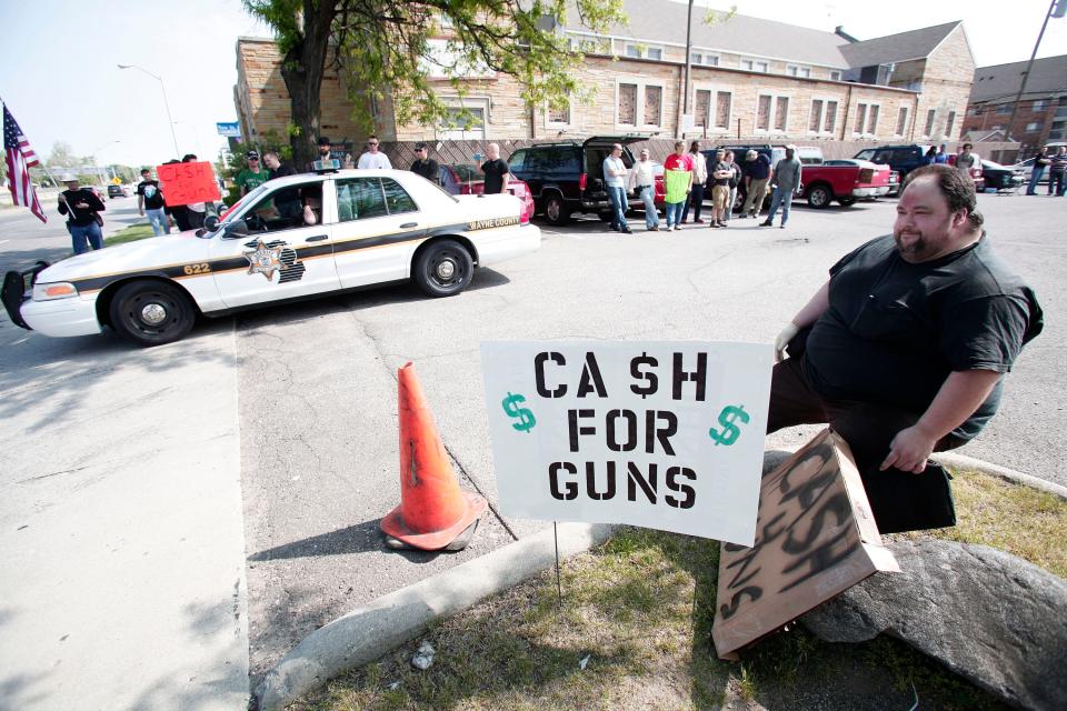 Citizens offering cash for guns in 2013 in Detroit.