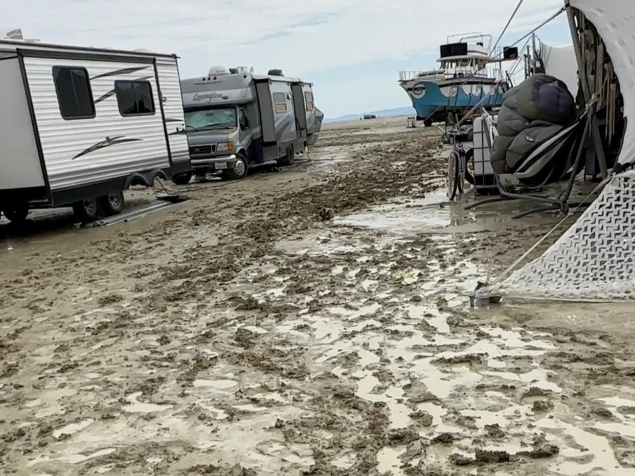 Mud covers the ground at the site of the Burning Man festival (PAUL REDER via REUTERS)