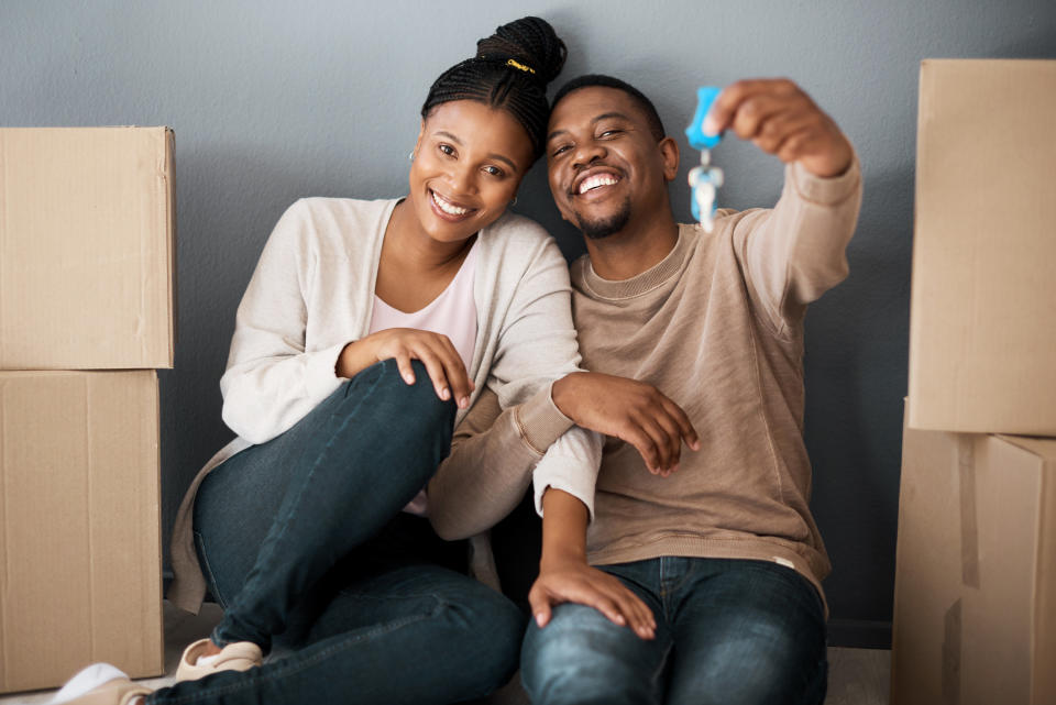 Couple holding the keys to their new house