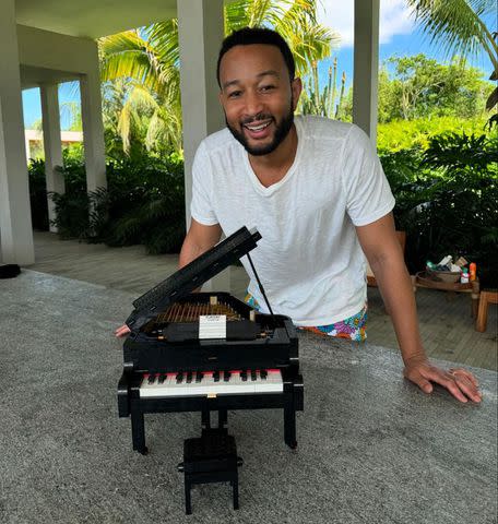 <p>Chriss Teigen/instagram</p> John Legend with LEGO piano