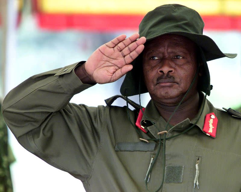 FILE PHOTO: Ugandan President Yoweri Museveni salutes during the funeral service March 27, 2004