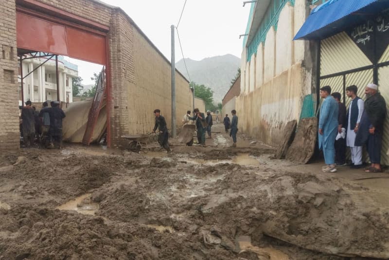 This photo provided by the Afghan Civil Protection shows a road flooded with mud after flash floods. Flooding caused by heavy rains over the past four days has claimed the lives of at least 50 people in Afghanistan, the country's National Disaster Management Authority reported on Tuesday. -/NDMA/dpa