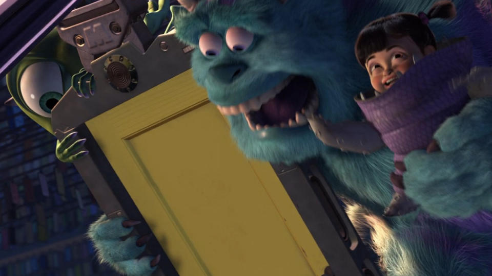 Mike, Sully, and Boo hold onto a door