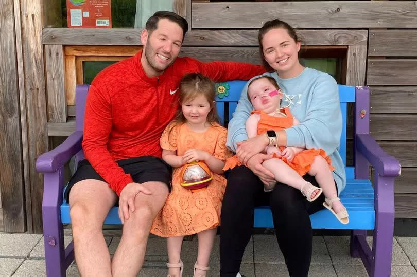 Ainslidh Stevenson and Jamie McMillan pictured with daughters Amelia (who died in July 2022) and big sister Olivia