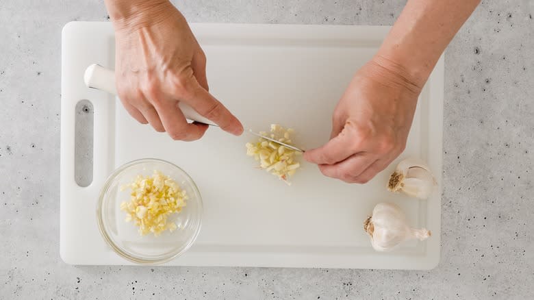 Minced garlic on a cutting board