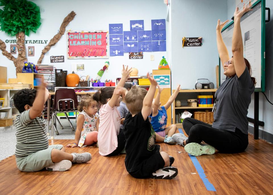 Gladimar de Jesus stretches with students in her 2-3 year-old classroom on Monday, Oct. 9, 2023, at Child’s Path in Naples.