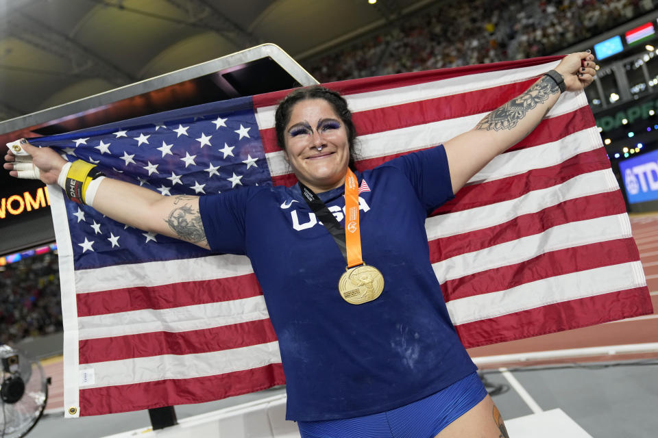 Chase Ealey, of the United States, poses after winning the gold medal in the Women's shot put final during the World Athletics Championships in Budapest, Hungary, Saturday, Aug. 26, 2023. (AP Photo/Matthias Schrader)