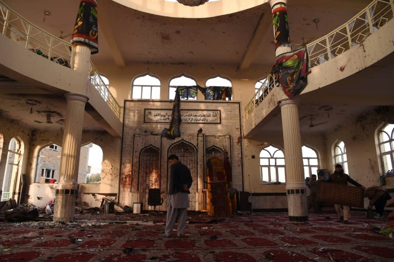 An Afghan resident inspects the Imam Zaman Shiite mosque the day after a suicide attack during Friday evening prayers, in Kabul on October 21, 2017