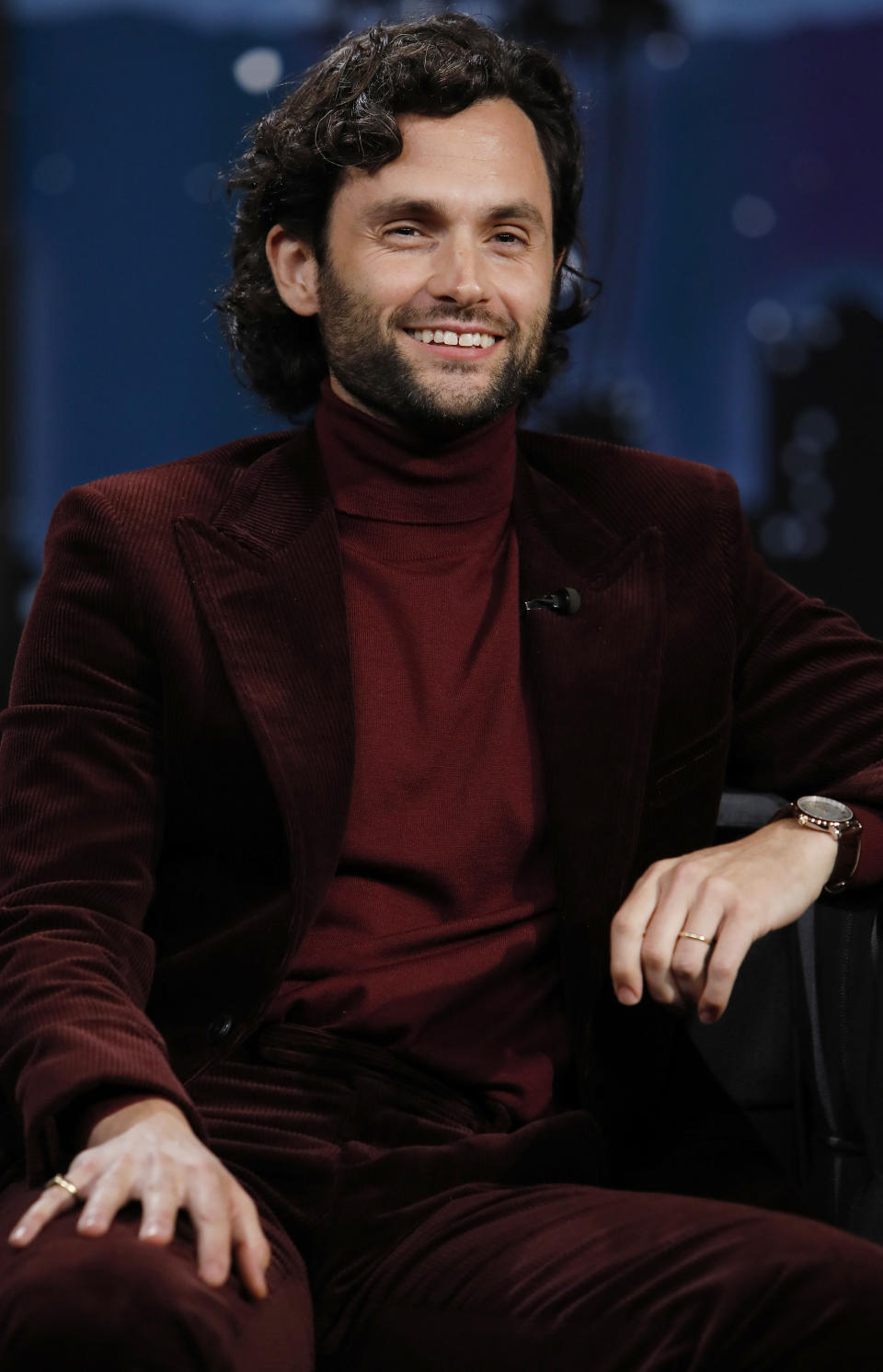 Penn Badgley smiles as he sits in as a guest on "Jimmy Kimmel Live!" in October 2021