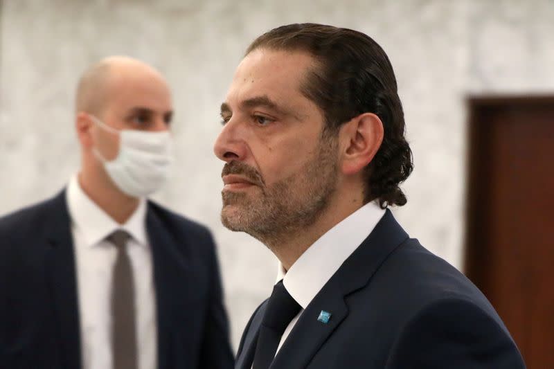 FILE PHOTO: Prime Minister-designate Saad al-Hariri walks by after meeting with Lebanon's President Michel Aoun at the presidential palace in Baabda