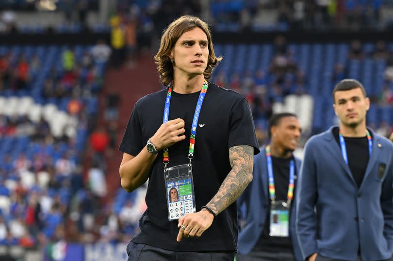 Riccardo Calafiori of Italy looks on as he inspects the pitch with teammates prior to the UEFA EURO 2024 group stage match between Spain and Italy at Arena AufSchalke