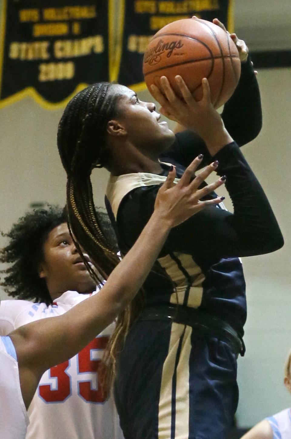 Archbishop Hoban's Lanae Riley shoots against Villa Angela-St. Joseph in the first half of the the Knights' 77-21 victory Monday night in Akron. [Mike Cardew/Beacon Journal]