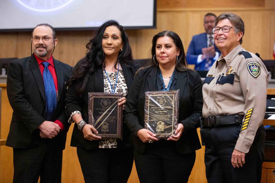 DASO Sheriff Kim Stewart, right, poses for a photo with employees Lucy Narvaez and Rachel Torres, middle, and CALEA regional manager Mark Mosier, left, during the Board of County Commissioners meeting on Tuesday, Nov. 28, 2023, at the Doña Ana County Government Building.