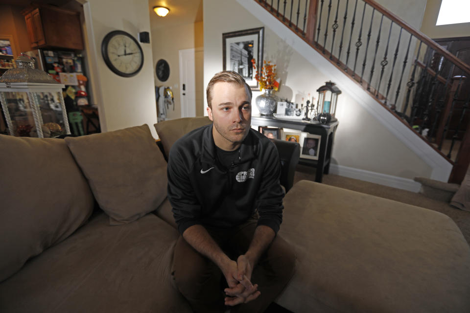 Austin Cloes, a Utah relative of the Americans killed in Mexico in what appears to be an attack by the cartels, speaks during an interview Tuesday, Nov. 5, 2019, in Herriman, Utah. Drug cartel gunmen ambushed three SUVs along a dirt road, slaughtering at least six children and three women all of them U.S. citizens living in northern Mexico in a grisly attack that left one vehicle a burned-out, bullet-riddled hulk, authorities said Tuesday, Nov. 5, 2019. (AP Photo/Rick Bowmer)