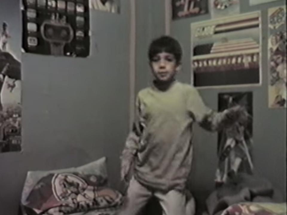 Lin-Manuel Miranda as a child dancing in his bedroom.