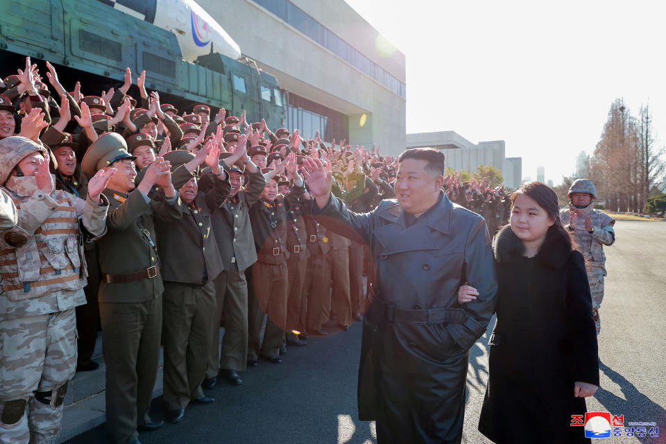 North Korean leader Kim Jong Un and his daughter attend a photo session with the scientists, engineers, military officials and others involved in the test-fire of the country's new Hwasong-17 intercontinental ballistic missile (ICBM) in this undated photo released on November 27, 2022 by North Korea's Korean Central News Agency (KCNA) KCNA via REUTERS    ATTENTION EDITORS - THIS IMAGE WAS PROVIDED BY A THIRD PARTY. REUTERS IS UNABLE TO INDEPENDENTLY VERIFY THIS IMAGE. NO THIRD PARTY SALES. SOUTH KOREA OUT. NO COMMERCIAL OR EDITORIAL SALES IN SOUTH KOREA.